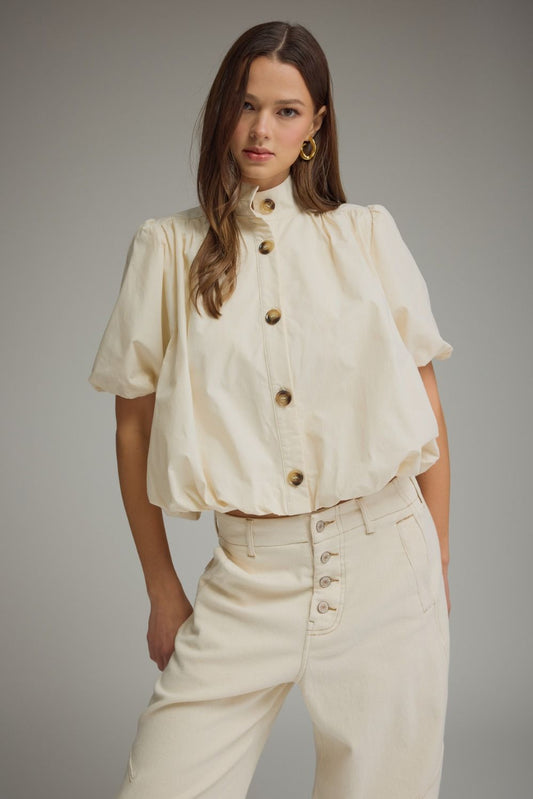 Ecru cotton puff sleeve bubble hem top with band collar and front button closure